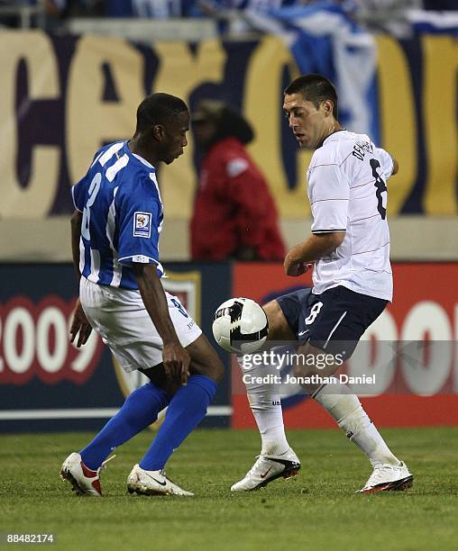 Clint Dempsey of the United States and Maynor Figueroa of Honduras battle for the ball during a FIFA 2010 World Cup Qualifying match on June 6, 2009...