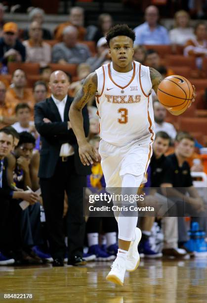 Jacob Young of the Texas Longhorns brings the ball up court against the Lipscomb Bisons at the Frank Erwin Center on November 18, 2017 in Austin,...