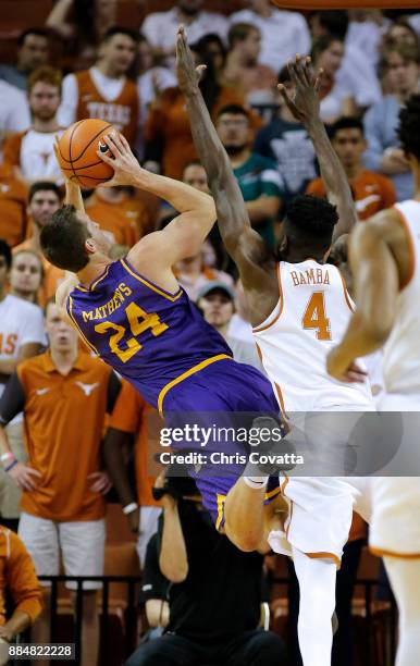 Garrison Mathews of the Lipscomb Bisons leaps to the basket against Mohamed Bamba of the Texas Longhorns at the Frank Erwin Center on November 18,...