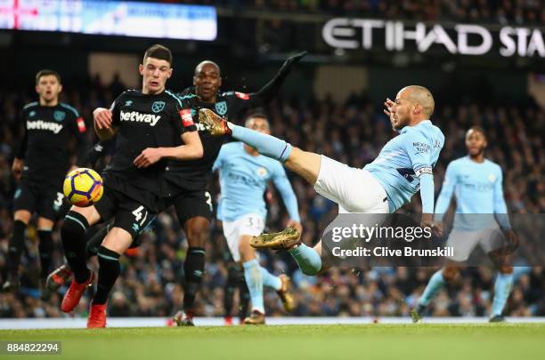 David Silva of Manchester City scores his sides second goal during the Premier League match between Manchester City and West Ham United at Etihad...