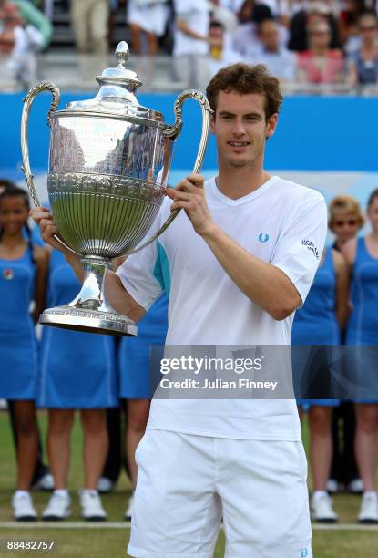 Andy Murray of Great Britain celebrates winning the match and the Championship with the trophy during the men's final match against James Blake of...