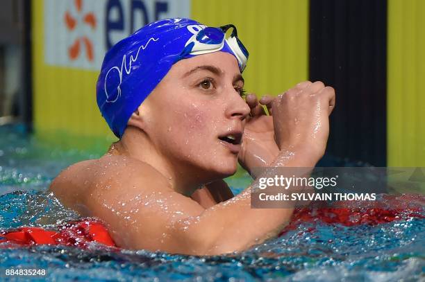 Swimmer Charlotte Bonnet reacts after winning the final of the women's 400-meters freestyle at the 25m French swimming championships in Montpellier...