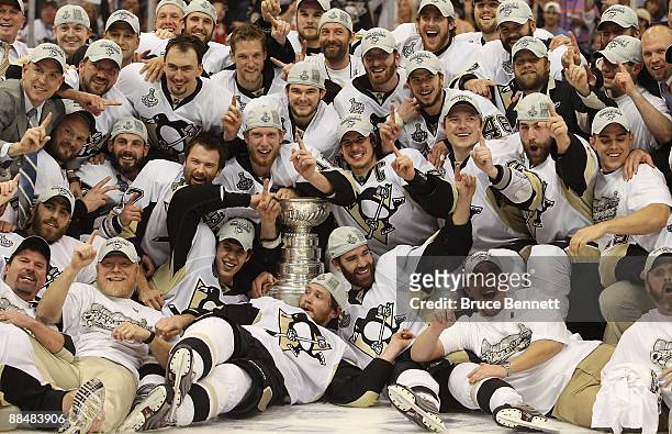 The Pittsburgh Penguins celebrate with the Stanley Cup after defeating the Detroit Red Wings by a score of 2-1 to win Game Seven and the 2009 NHL...