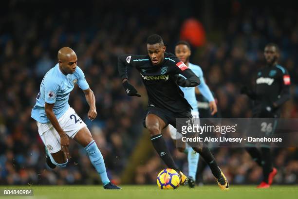 Edimilson Fernandes of West Ham United takes on Fernandinho of Manchester City during the Premier League match between Manchester City and West Ham...