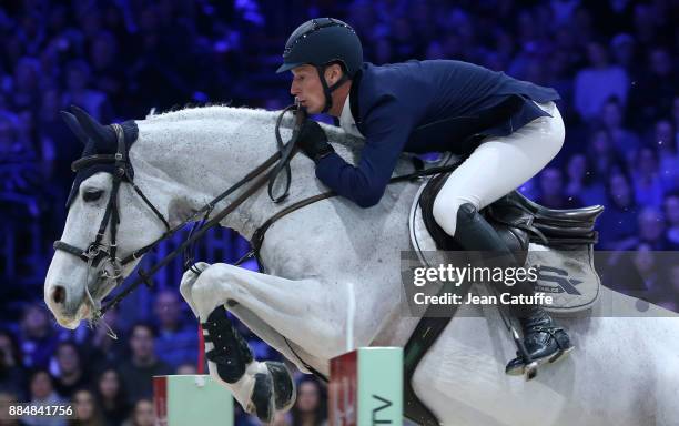 Winner Daniel Deusser of Germany rides 'Cornet d'Amour' during the Longines Grand Prix 2017 on day four of the Longines Masters Paris at Parc des...