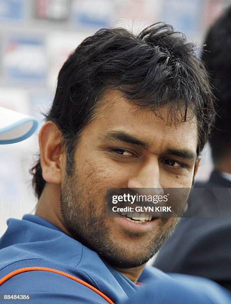 Mahendra Dhoni of India watches his batsmen from the team bench during the Super 8 stage of the ICC Twenty20 Cricket World Cup match against England...