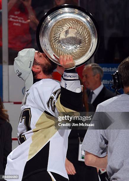 Craig Adams of the Pittsburgh Penguins celebrates with the Stanley Cup after defeating the Detroit Red Wings by a score of 2-1 to win Game Seven and...