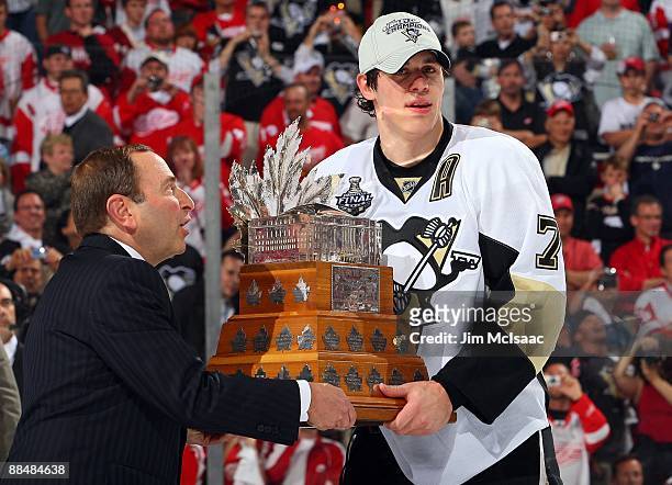 Commissioner Gary Bettman presents the Conn Smythe trophy to Evgeni Malkin of the Pittsburgh Penguins after defeating the Detroit Red Wings in Game...