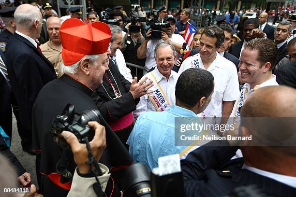 New York City Mayor Michael Bloomberg meets with the Archbishop Timothy Dolan during the 2009 Puerto Rican Day Parade on the streets of Manhattan on...