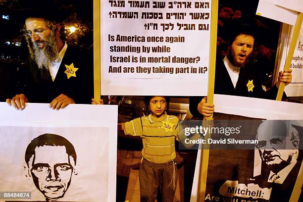 Ultra-Orthodox Jewish right-wing protestors wear Nazi-style yellow Star of David badges as they demonstrate against US President Barack Obama after...