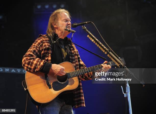 Neil Young performs on stage on day 3 of the Isle Of Wight Festival at Seaclose Park on June 14, 2009 in Newport, Isle of Wight.