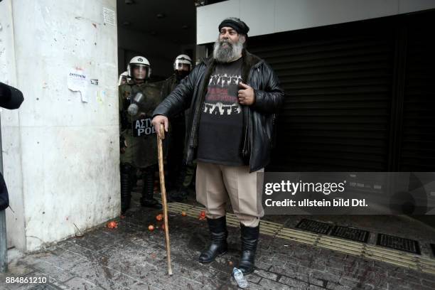 Farmers from the island of Crete protest outside the building of the Agriculture Ministry, against taxation and pension cuts. In Athens, on Friday,...