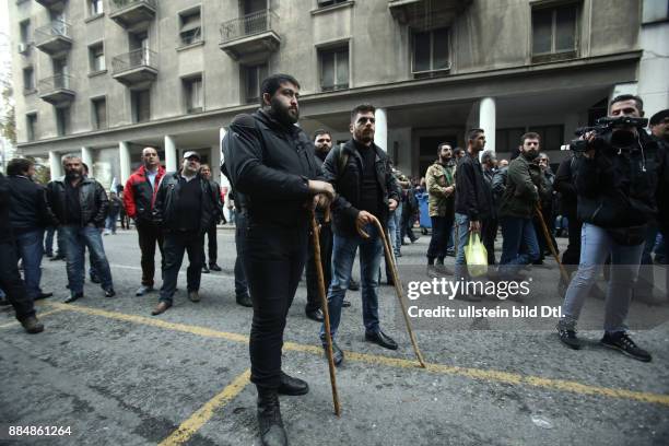 Farmers from the island of Crete protest outside the building of the Agriculture Ministry, against taxation and pension cuts. In Athens, on Friday,...