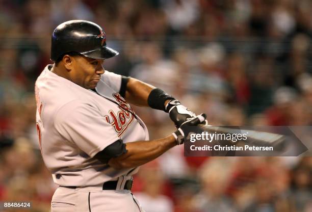 Miguel Tejada of the Houston Astros hits a RBI ground out against the Arizona Diamondbacks during the seventh inning of the major league baseball...