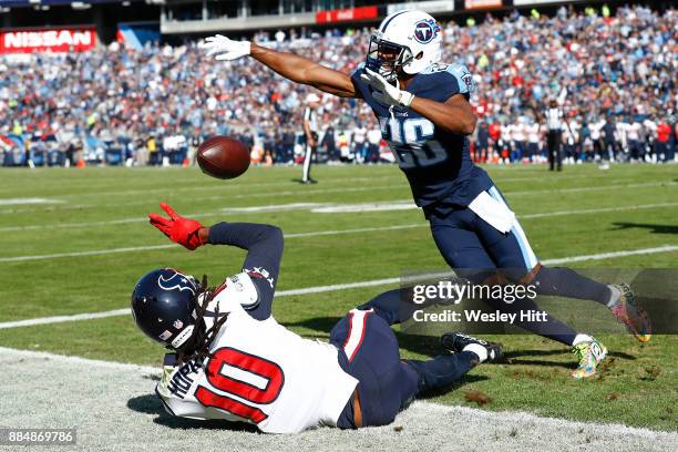 Logan Ryan of the Tennessee Titans swats away a pass intended for DeAndre Hopkins of the Houston Texans during the first half at Nissan Stadium on...