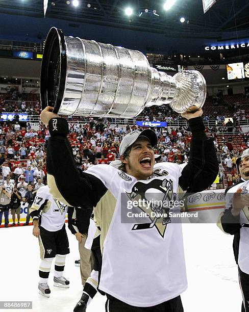 Sidney Crosby of the Pittsburgh Penguins hoists the Stanley Cup following a 2-1 victory over the Detroit Red Wings during Game Seven of the 2009...