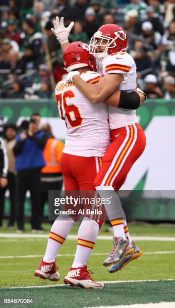 Travis Kelce of the Kansas City Chiefs celebrates with Laurent Duvernay-Tardif of the Kansas City Chiefs after scoring a touchdown in the first...