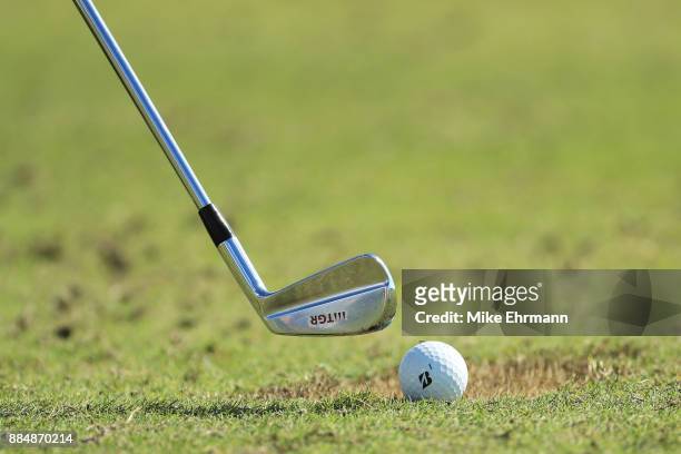 Club detail as Tiger Woods of the United States warms up on the range prior to the final round of the Hero World Challenge at Albany, Bahamas on...