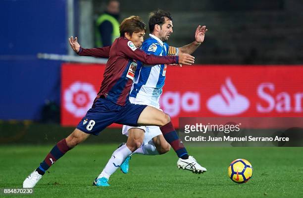 Takashi Inui of SD Eibar duels for the ball with Victor Sanchez Mata of RCD Espanyol during the La Liga match between SD Eibar and RCD Espanyol at...