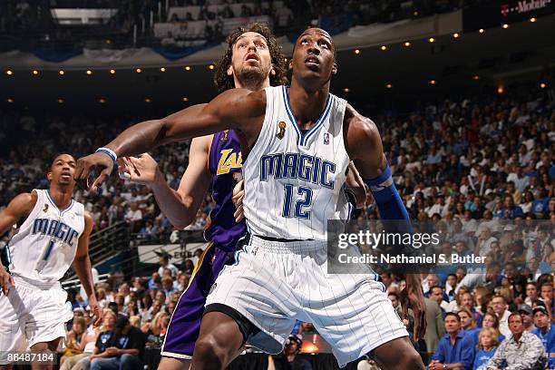 Pau Gasol of the Los Angeles Lakers fights for rebound position against Dwight Howard of the Orlando Magic in Game Five of the 2009 NBA Finals at...