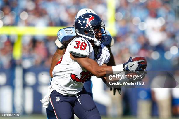 Andre Ellington of the Houston Texans makes a catch against the Tennessee Titans during the first half at Nissan Stadium on December 3, 2017 in...