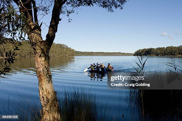 Competitors paddle across Smiths Lake on hand made rafts on day two of the the GeoQuest 48 hour Adventure race held around the Barrington Tops and...