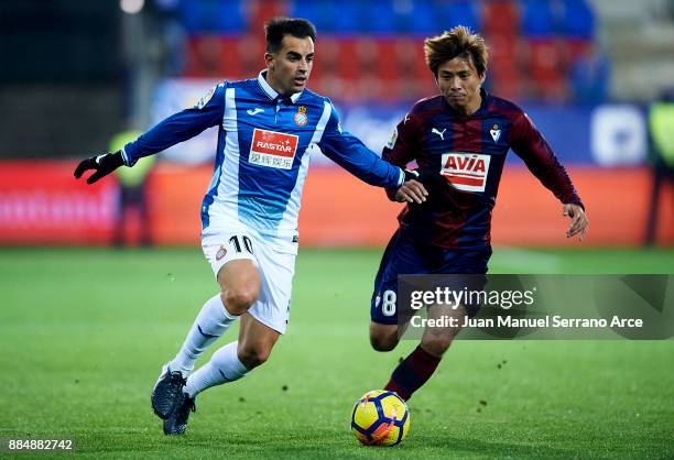 Takashi Inui of SD Eibar duels for the ball with Jose Manuel Jurado Marin of RCD Espanyol during the La Liga match between SD Eibar and RCD Espanyol...