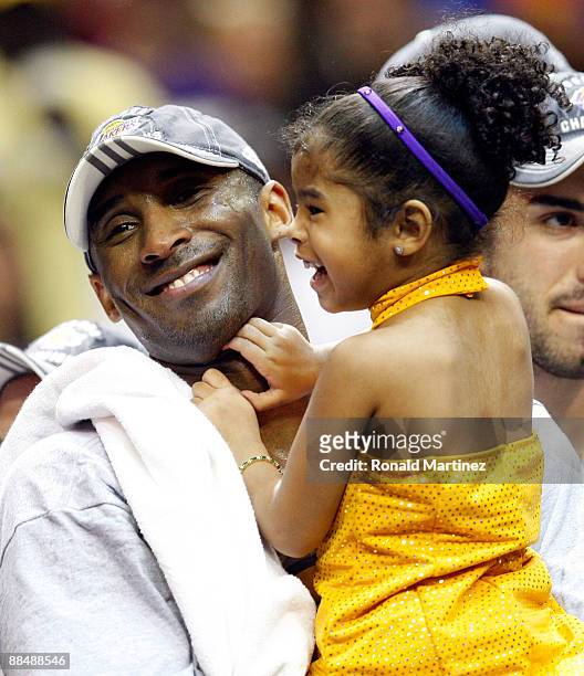 Kobe Bryant of the Los Angeles Lakers holds his daughter, Gianna, after the Lakers defeated the Orlando Magic 99-86 in Game Five of the 2009 NBA...