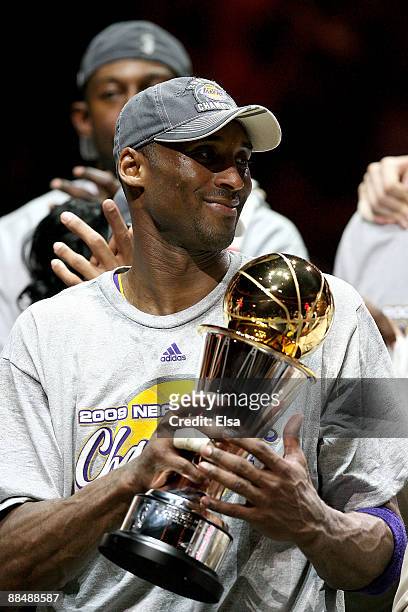 Kobe Bryant of the Los Angeles Lakers holds the MVP trophy after the Lakers defeated the Orlando Magic 99-86 in Game Five of the 2009 NBA Finals on...