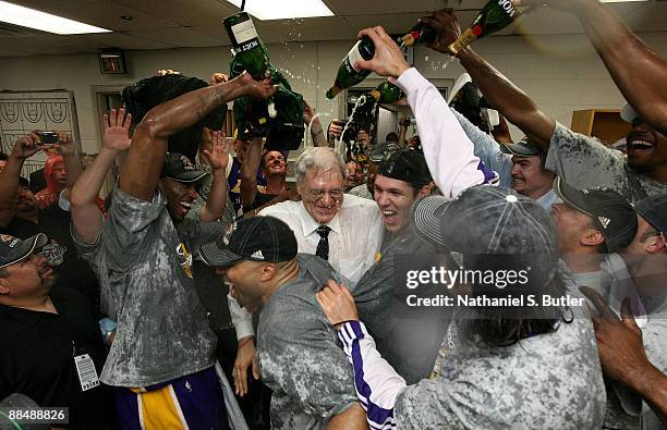 Kobe Bryant, Derek FIsher, head coach Phil Jackson and Luke Walton of the Los Angeles Lakers celebrate in the locker room with their teammates after...