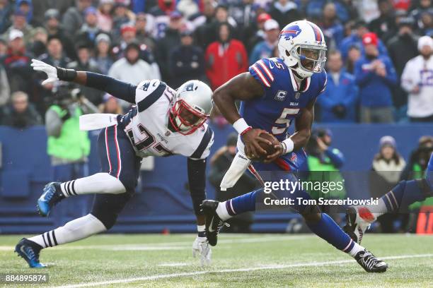 Jordan Richards of the New England Patriots attempts to tackle Tyrod Taylor of the Buffalo Bills during the first quarter on December 3, 2017 at New...