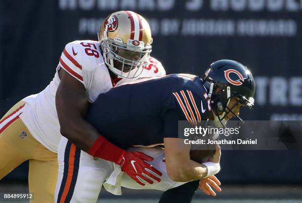 Quarterback Mitchell Trubisky of the Chicago Bears is sacked by Elvis Dumervil of the San Francisco 49ers in the first quarter at Soldier Field on...
