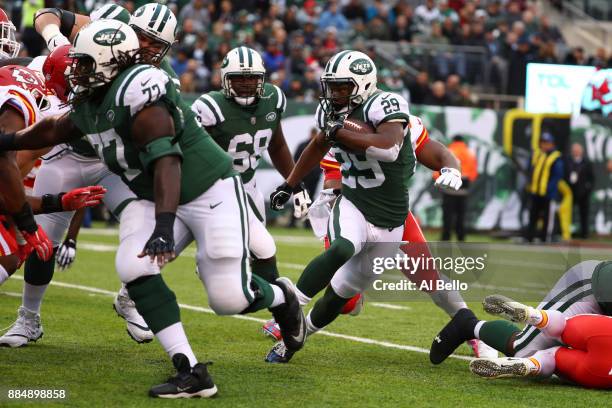Bilal Powell of the New York Jets makes a run before scoring a touchdown during their game at MetLife Stadium on December 3, 2017 in East Rutherford,...