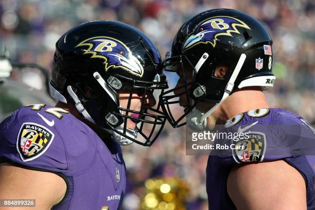 Fullback Patrick Ricard and tight end Nick Boyle of the Baltimore Ravens celebrate a touchdown in the second quarter against the Detroit Lions at M&T...