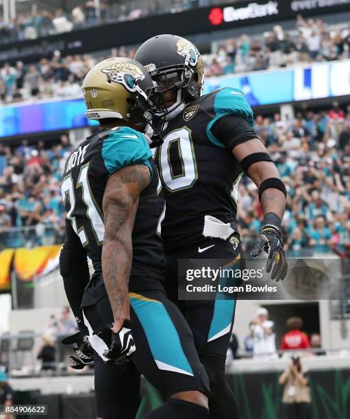 Jalen Ramsey and A.J. Bouye of the Jacksonville Jaguars celebrate after Ramsey had an interception in the first half of their game against the...