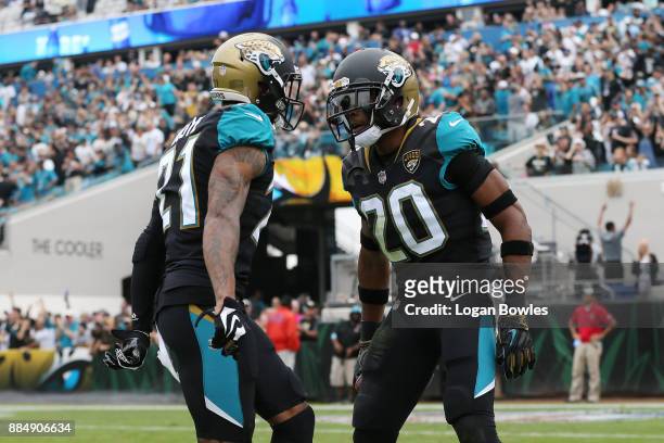 Jalen Ramsey and A.J. Bouye of the Jacksonville Jaguars celebrate after Ramsey had an interception in the first half of their game against the...