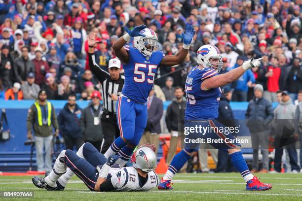 Jerry Hughes of the Buffalo Bills and Kyle Williams of the Buffalo Bills celebrate after Williams sacked Tom Brady of the New England Patriots during...