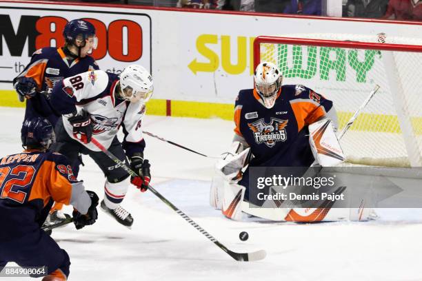 Goaltender Luke Cavallin of the Flint Firebirds defends the net against forward Kirill Kozhevnikov of the Windsor Spitfires on December 3, 2017 at...