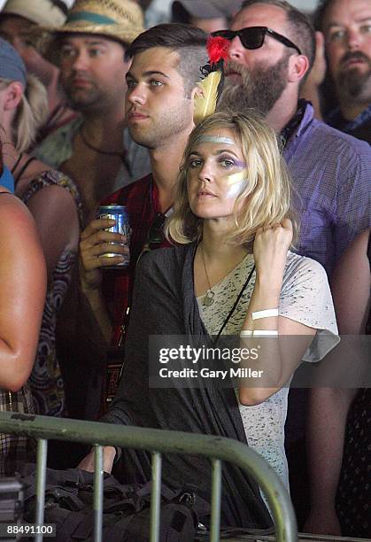 Actress Drew Barrymore watches Bon Iver perform during the 2009 Bonnaroo Music and Arts Festival on June 13, 2009 in Manchester, Tennessee.
