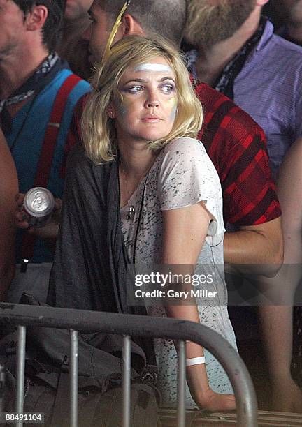 Actress Drew Barrymore watches Bon Iver perform during the 2009 Bonnaroo Music and Arts Festival on June 13, 2009 in Manchester, Tennessee.