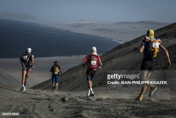 Competitors take part in the fifth stage 5 during the first edition of the Marathon des Sables Peru between Barloveto and Mendieta in the Ica desert...