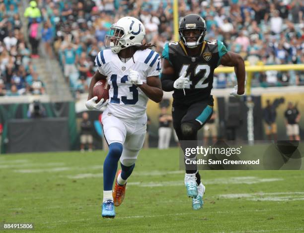 Hilton of the Indianapolis Colts runs for a 40-yard touchdown past Barry Church of the Jacksonville Jaguars in the second half of their game at...