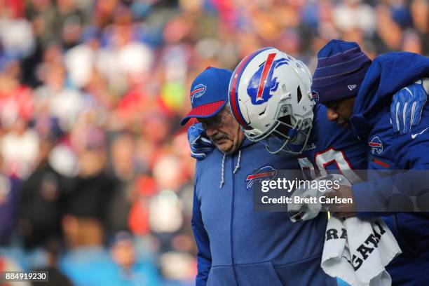 Shaq Lawson of the Buffalo Bills is helped off the field during the third quarter against the New England Patriots on December 3, 2017 at New Era...