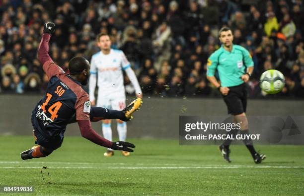 Montpellier's Ivorian forward Giovanni Sio shoots to open the scoring during the French L1 football match between Montpellier and Marseille on...