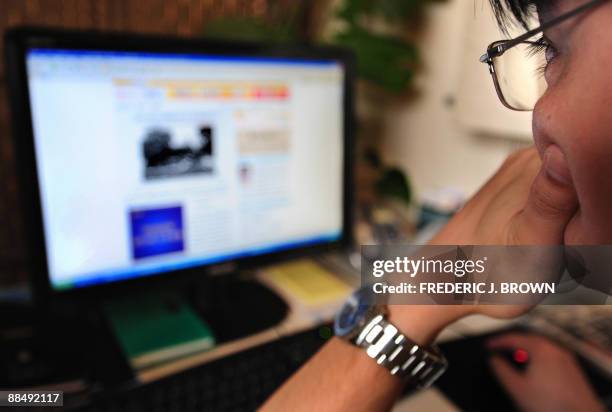 Man surfs the internet in Beijing on June 15, 2009. The designers of controversial Internet filtering software that China has ordered shipped with...