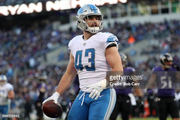 Middle Linebacker Nick Bellore of the Detroit Lions celebrates after scoring a touchdown in the fourth quarter against the Baltimore Ravens at M&T...