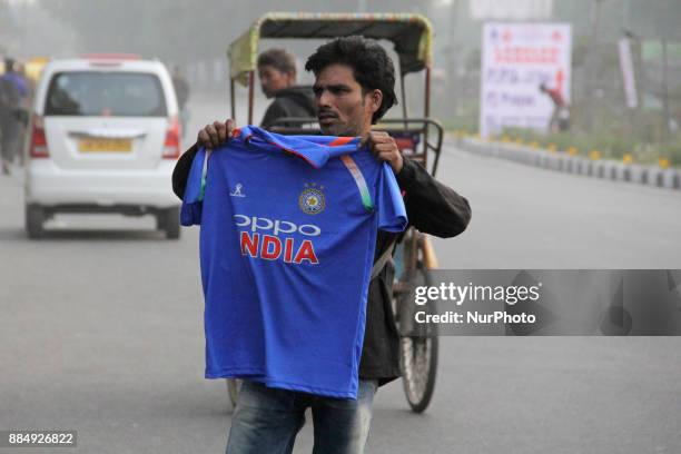 Vendor sells T-Shirts outside Feroz Shah Kotla Stadium on the 2nd Day of 3rd Test Match between india and Sri Lanka in New Delhi, India, on 3...