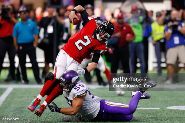 Matt Ryan of the Atlanta Falcons is tackled by Anthony Barr of the Minnesota Vikings during the second half at Mercedes-Benz Stadium on December 3,...