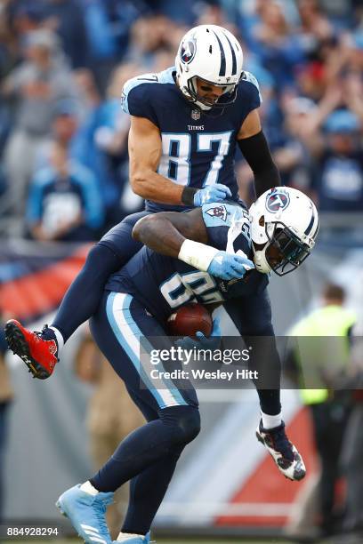 Eric Decker of the Tennessee Titans celebratres with Delanie Walker after a touchdown against the Houston Texans during the second half at Nissan...