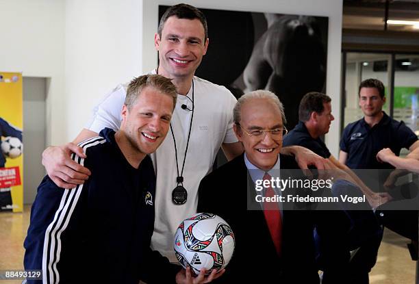 Oliver Pocher, Vitali Klitschko and Matze Knop pose for the media during the presentation of the competency team for Oliver Pochers casting show at...